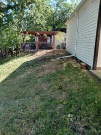 Two neat piles of mulch left where the stumps were removed.